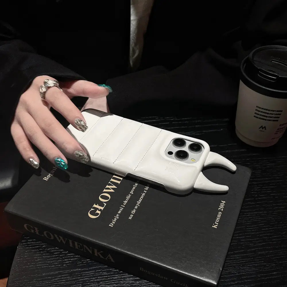 white devil horn quilted leather iphone case showing the back with horn-like protrusions and textured design