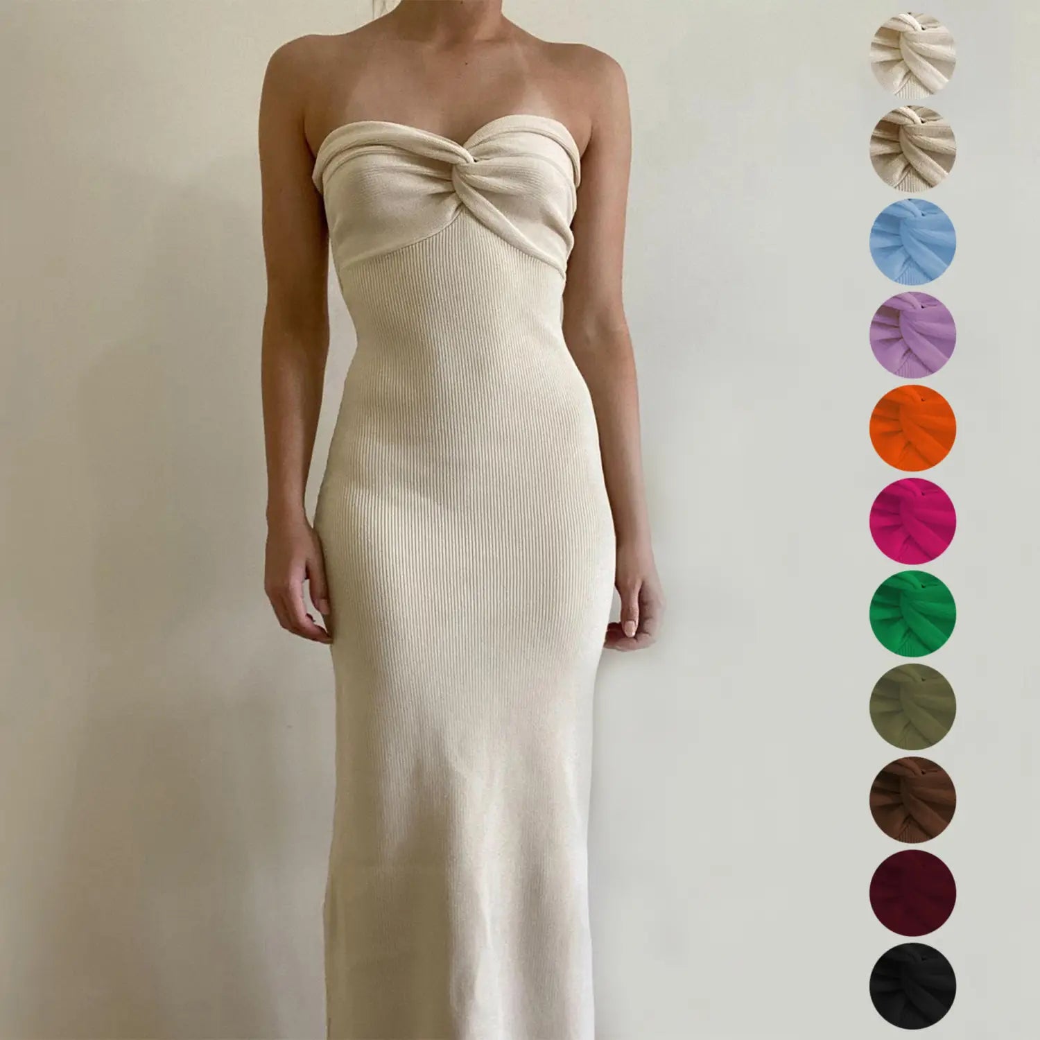 Cream-colored ribbed knit midi dress with off shoulder style and twisted knot detail at the bust.