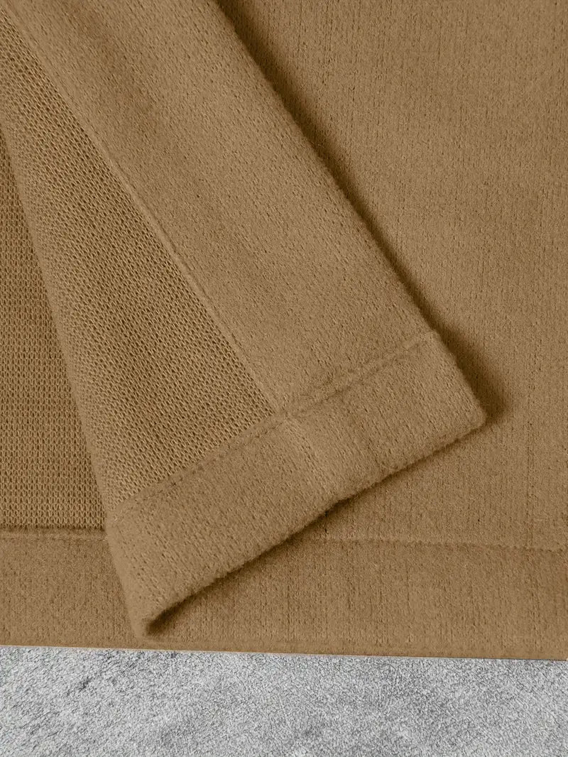 Tan knitted sleeve with a textured ribbed cuff on a men’s classic slim fit wool blend lapel jacket.