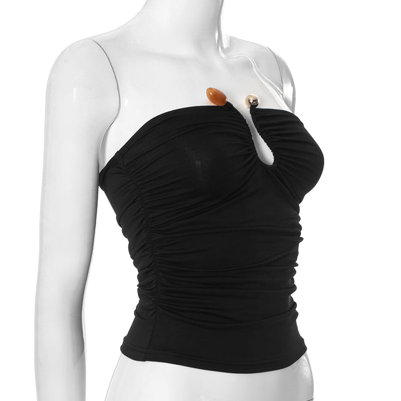 Black ruched strapless keyhole crop top featuring a distinctive amber and metallic button closure at the neckline.