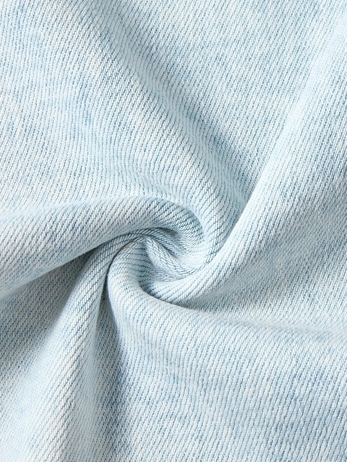 light blue denim fabric with a soft slightly faded texture and visible diagonal weave used for wide leg stretch denim jeans.