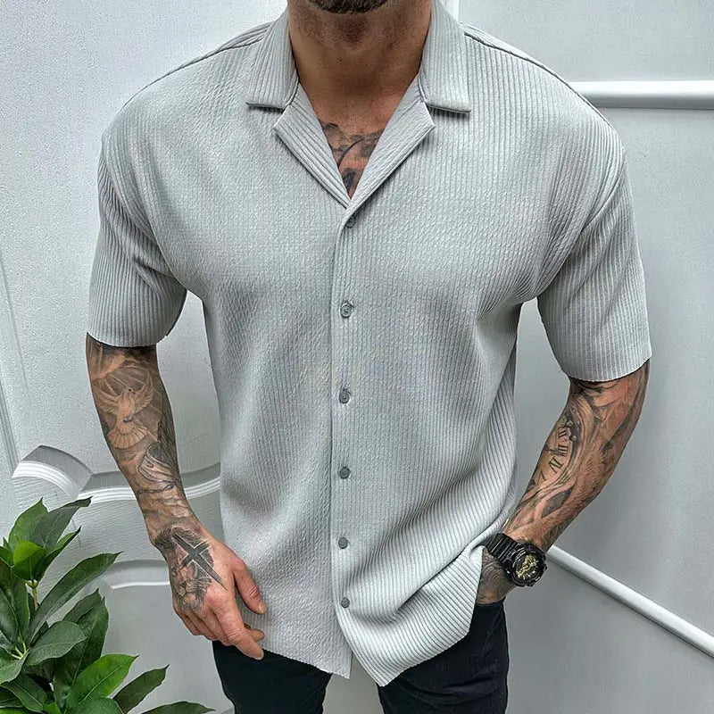 Men’s ribbed knit short sleeve button up shirt in light gray featuring a collar and front buttons.
