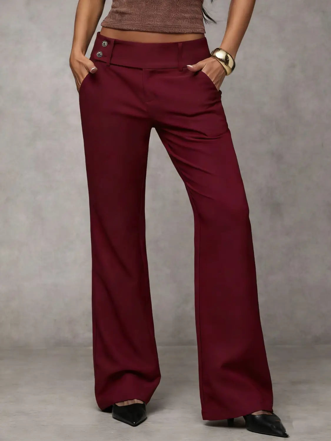 Burgundy wide leg work pants with a high waist and double button closure designed for casual wear.