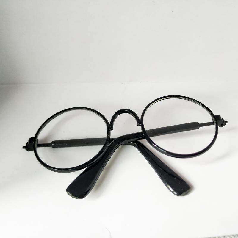 Black round-framed glasses with sleek glossy finish and thin arms featured alongside rose gold metal round cat sunglasses with mirrored lenses.