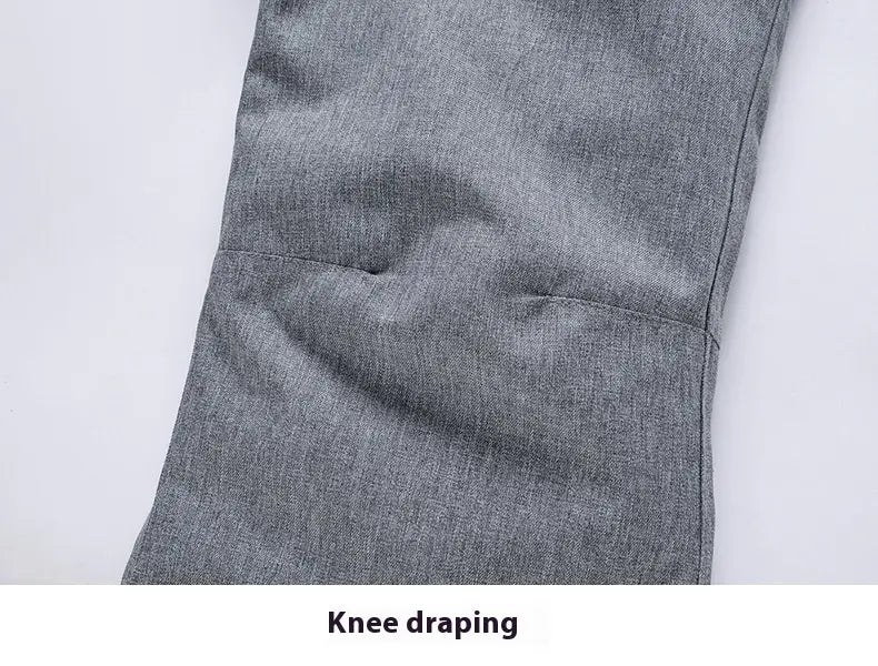Men waterproof thermal snow pants in gray heathered fabric with subtle textured weave and reinforced knee draping.