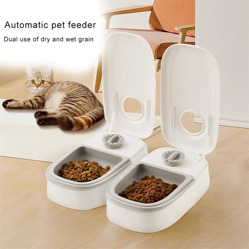 White and gray automatic pet feeder with dual compartments for dry and wet food designed as a gravity waterer and food dispenser.