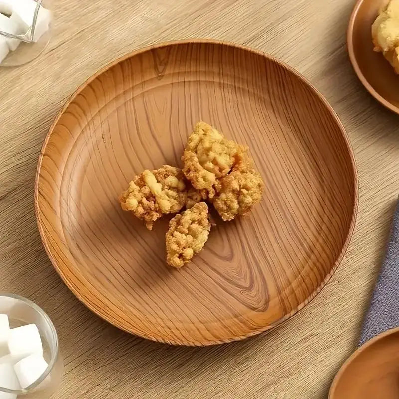 Round wooden plate featuring a natural wood grain pattern and warm brown finish from the wood grain plastic plates 10pc round striped design set.