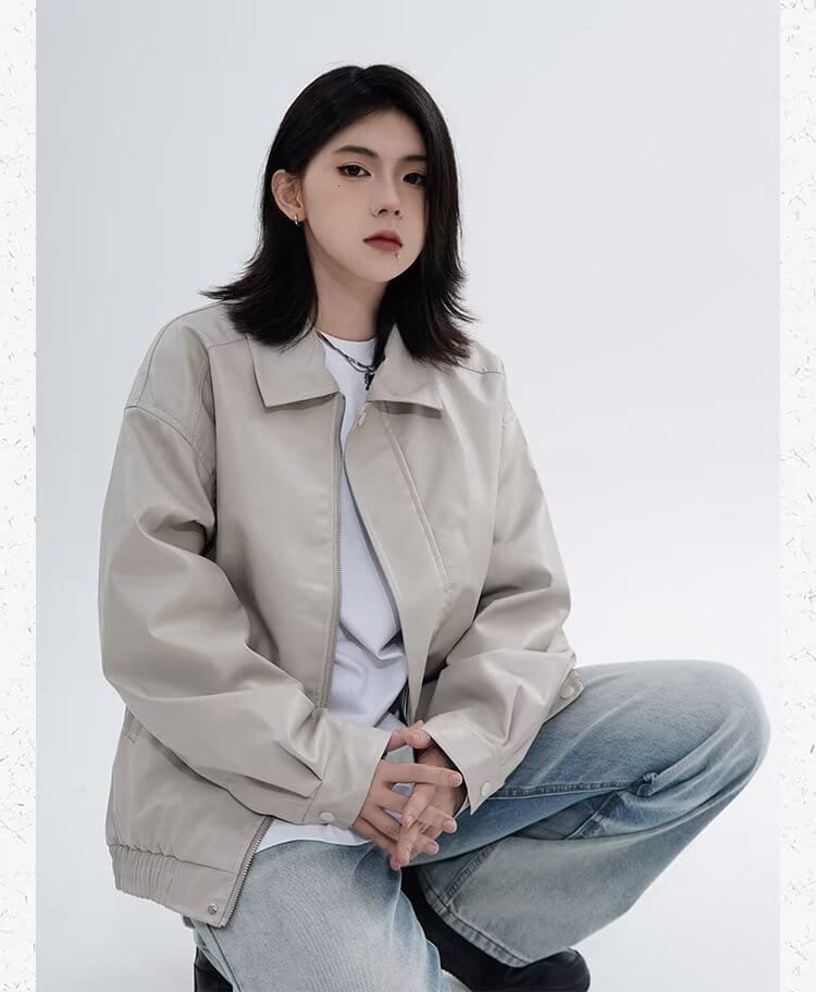 Beige faux leather bomber jacket with a classic collar and zipper closure designed for men with a relaxed fit outerwear style.