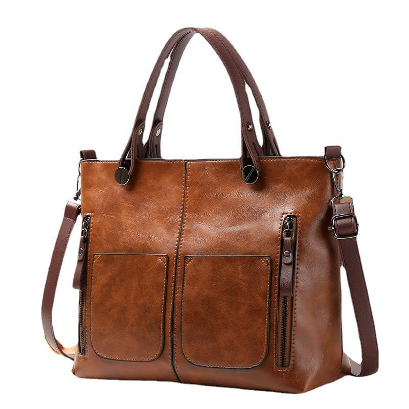 Brown leather retro large capacity tote crossbody bag with two front zippered pockets and a detachable shoulder strap.