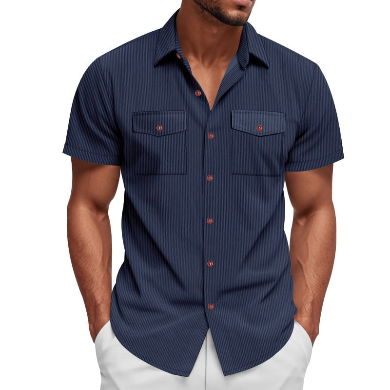 Navy blue loose corduroy short sleeve workwear shirt with fine vertical stripes and rust-colored buttons.