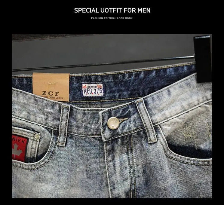 Distressed maple leaf denim shorts feature washed blue denim with a faded distressed look and visible stitching details.