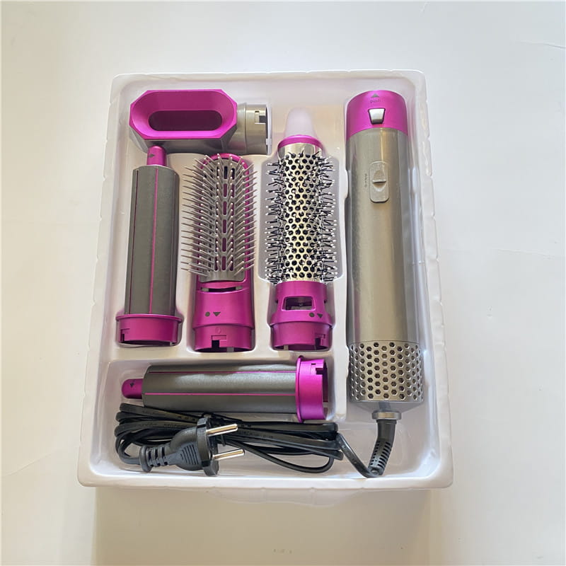 Pink and silver 5-in-1 hot air comb hair dryer and styler set with multiple attachments for versatile hair styling
