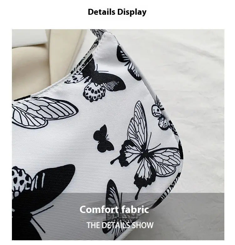 Masque facial blanc à motifs de papillon noir, imprimés sur un tissu confortable, assorti à un sac sous-bras en nylon à imprimé léopard et à carreaux.