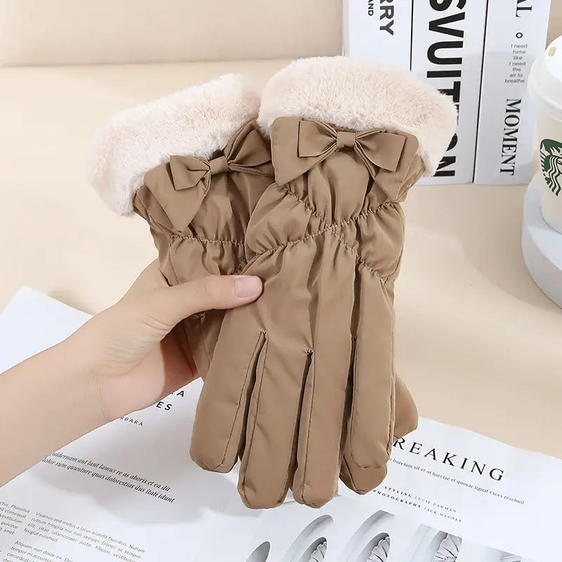 beige women touch screen winter fleece gloves with plush white fur cuffs and matching fabric bows on the back side of each hand