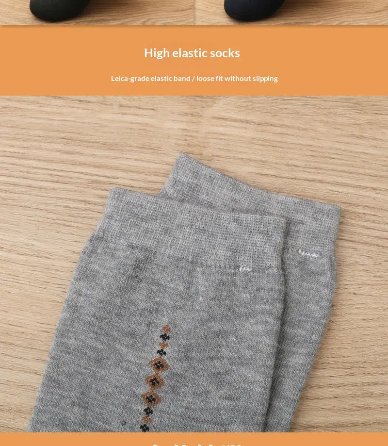 Men mid calf crew socks 5 pack featuring gray high elastic material with a subtle pattern of brown and black floral motifs along the side.
