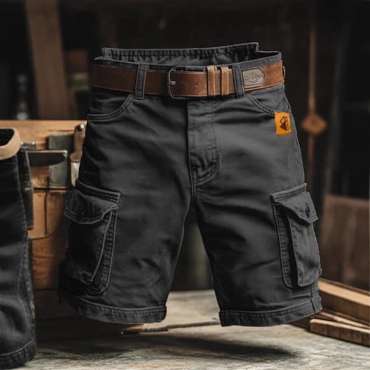 Men’s dark gray digital print cargo shorts made of polyester with multiple pockets and a brown leather belt.