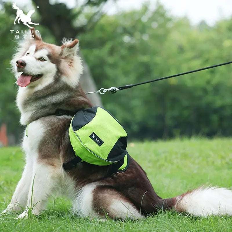 Bright neon green and black tailup dog backpack made of oxford cloth with reflective strips and adjustable straps designed for pet hiking.