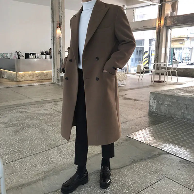 A sleek double-breasted camel-colored wool overcoat with dark buttons and a classic tailored fit designed as a men wool overcoat double breasted winter jacket.