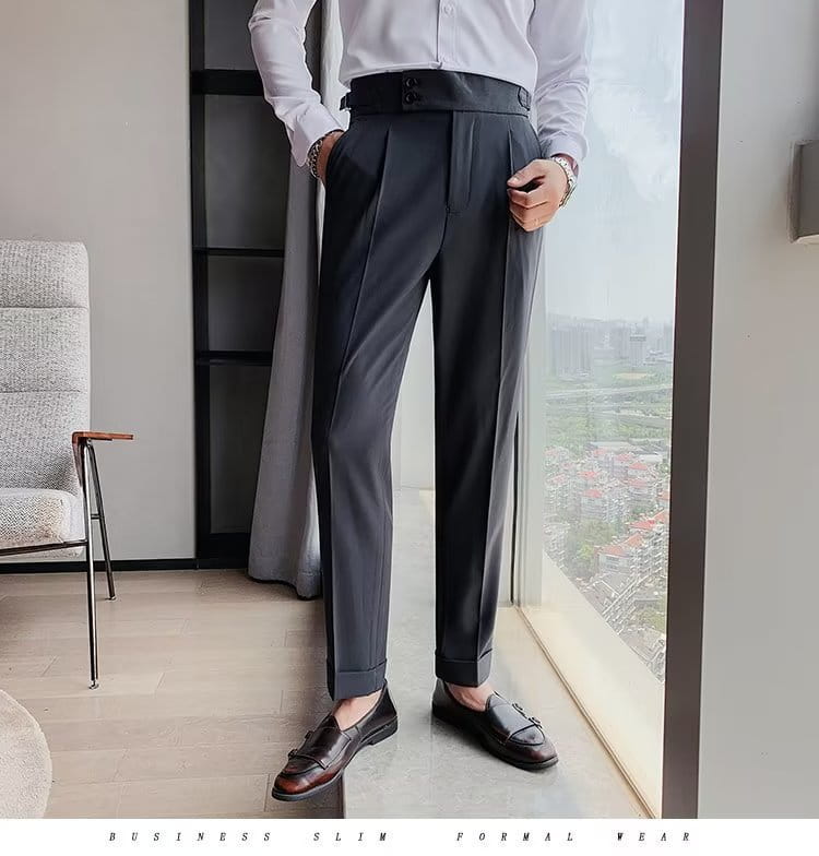 Dark gray slim-fit Korean style men trousers with tailored pleats and buttoned waistband suitable for business wear.