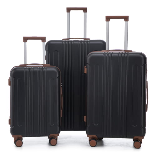Set of three black hard-shell abs spinner luggage suitcases with brown accents silver extendable handles and tsa lock.