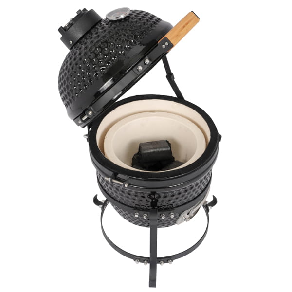 Black ceramic 13 inch kamado charcoal grill with a wooden handle on the lid and a beige interior.