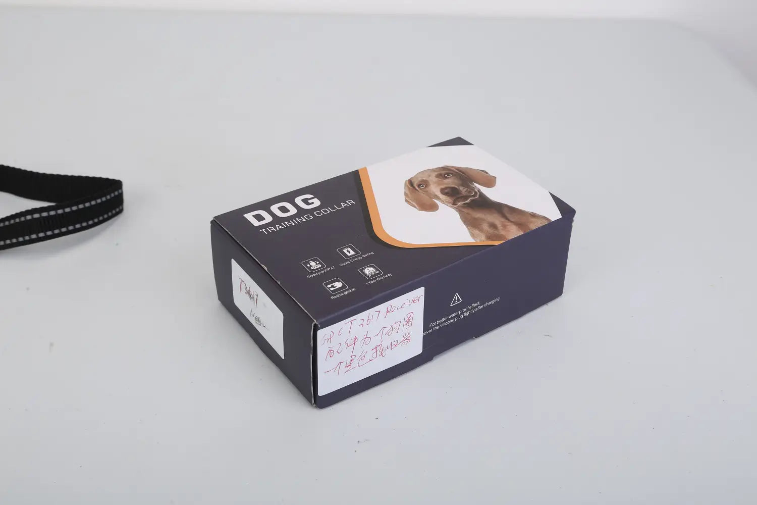 Black rectangular box of dog training collar 3280ft waterproof shock system featuring a photo of a brown dog on the front