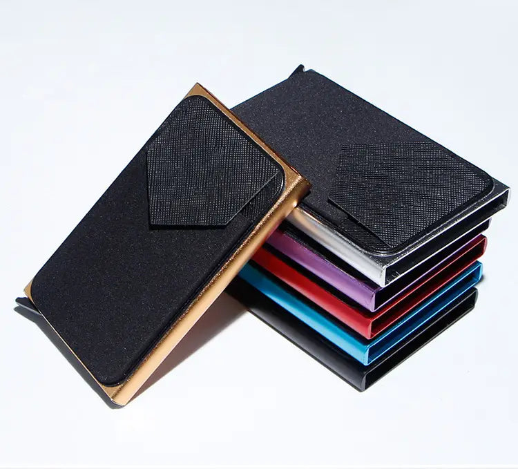 Black textured minimalist RFID blocking aluminum multi card wallet with gold-tone edges and matching pocket flap.