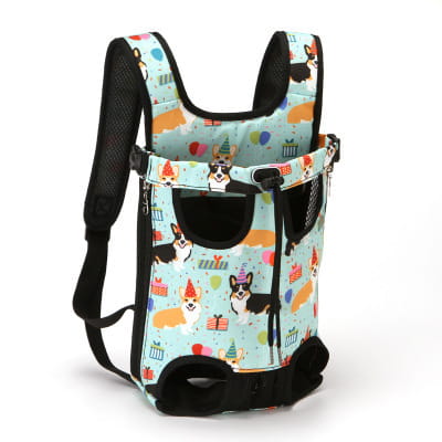Light blue breathable pet carrier backpack with black straps and trim featuring a playful pattern of corgis wearing party hats alongside balloons and birthday cakes designed for small dogs and cats.