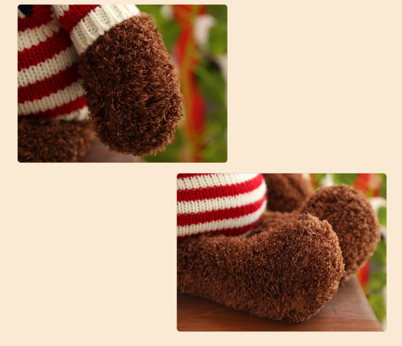 Oso de peluche marrón que lleva un suéter de punto a rayas rojas y blancas en un peluche de oso de 55 cm con suéter de punto.