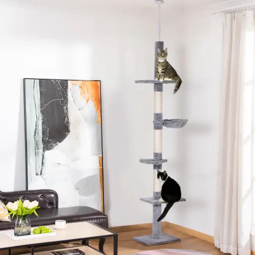 Gray multi-level adjustable floor to ceiling cat tree with sisal scratching posts and soft platforms for indoor feline use