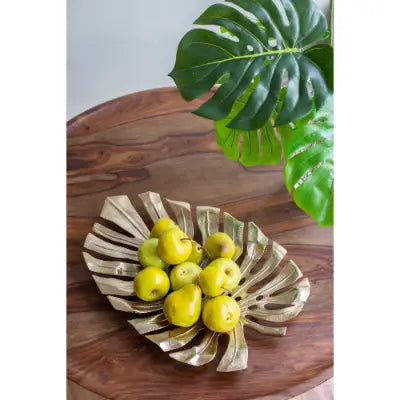 bronze monstera leaf-shaped fruit bowl serving tray in gold monstera leaf wall decor collection designed for elegant serving and display