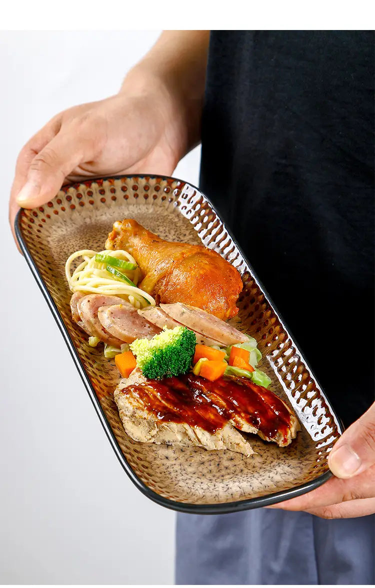 Brown ceramic serving tray with a textured speckled surface and raised edge measuring 12.5 inches for stylish serving and presentation.