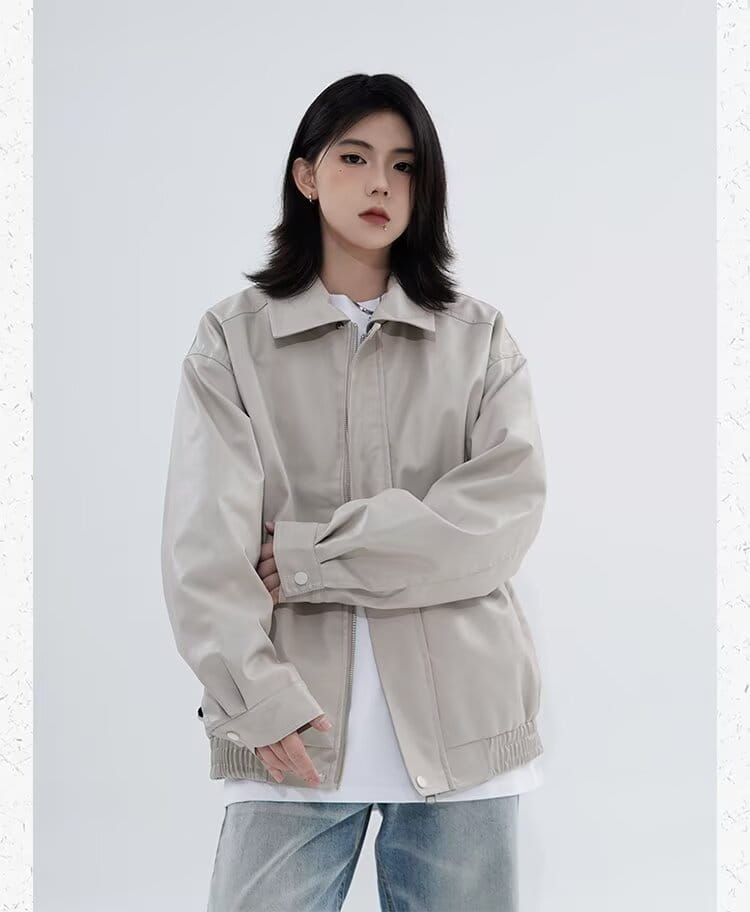Men’s beige faux leather bomber jacket with a classic collar, buttoned cuffs, and elasticated hem for relaxed fit outerwear.