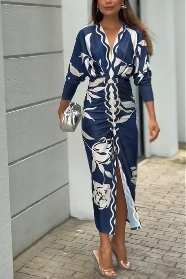 A navy blue and white floral print printed v-neck geometric wrap midi dress with three-quarter sleeves and a high slit.