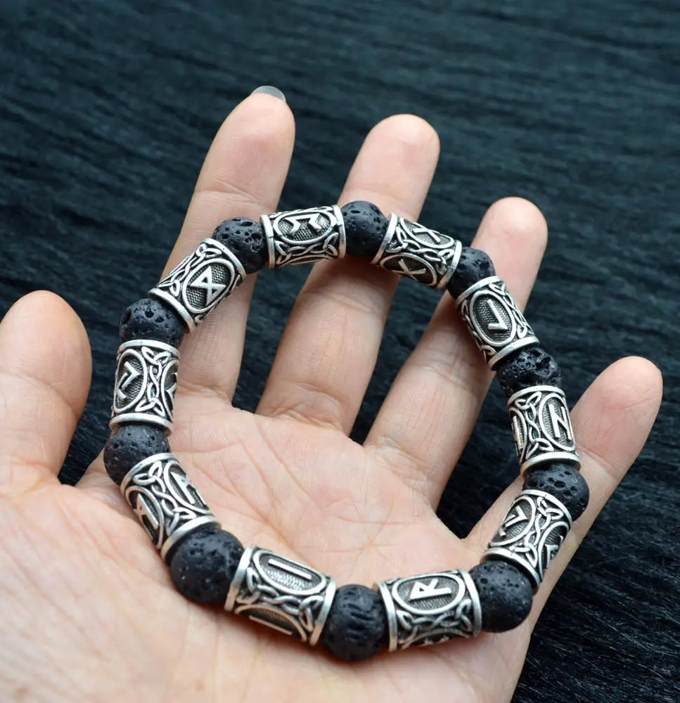 Asgard silver rune and black lava stone viking bracelet featuring silver-toned beads with intricate celtic knotwork designs.