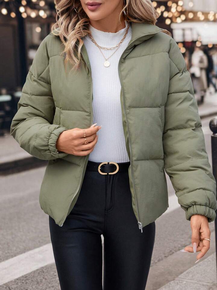 Olive green corduroy quilted puffer jacket with elastic cuffs and hood for plus size women winter coat.