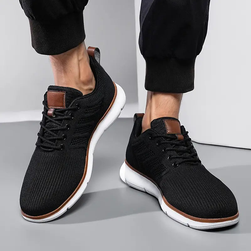 black knit mesh sneakers for men with brown leather accents and white soles designed for casual flying woven shoes use