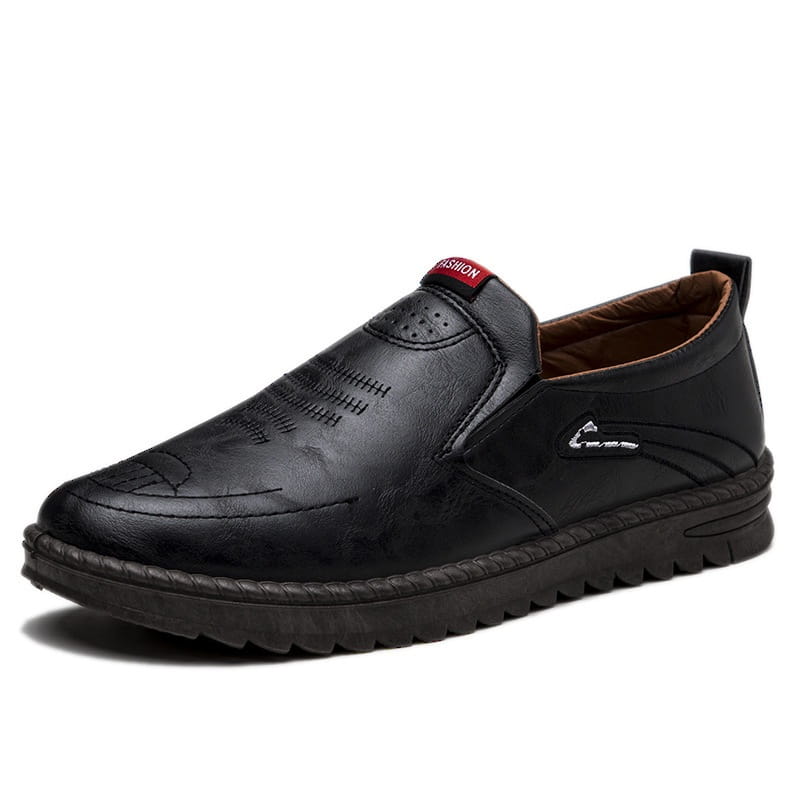 Men’s lightweight breathable white faux leather slip on shoe with brown embroidered detailing and textured rubber sole
