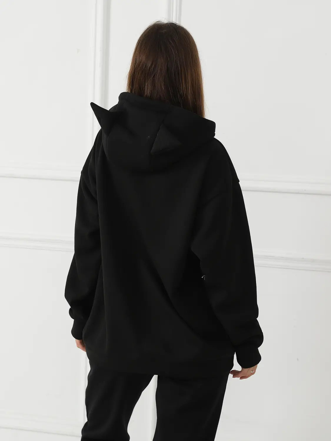 women’s black hoodie with cat ear hoods featuring a dalmatian print designed for casual wear
