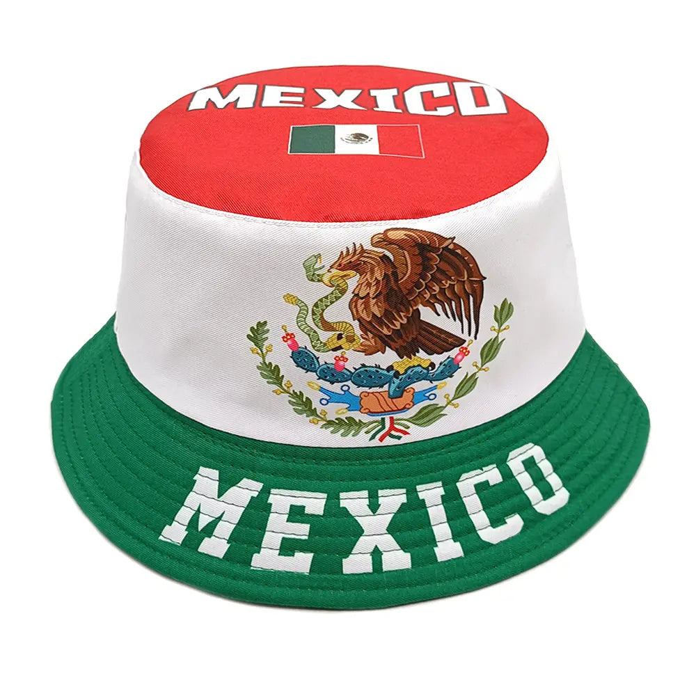 A white bucket hat with a red top panel featuring Mexico and the Mexican flag, a central embroidered eagle emblem on the crown, and a green brim with Mexico in bold white lettering providing sun protection.