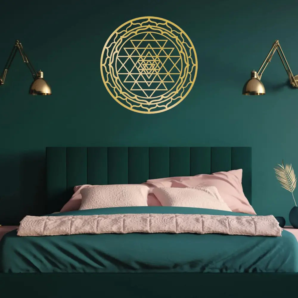 Gold-colored Sri Yantra sacred geometry metal wall art decor featuring intricate triangular and circular patterns.