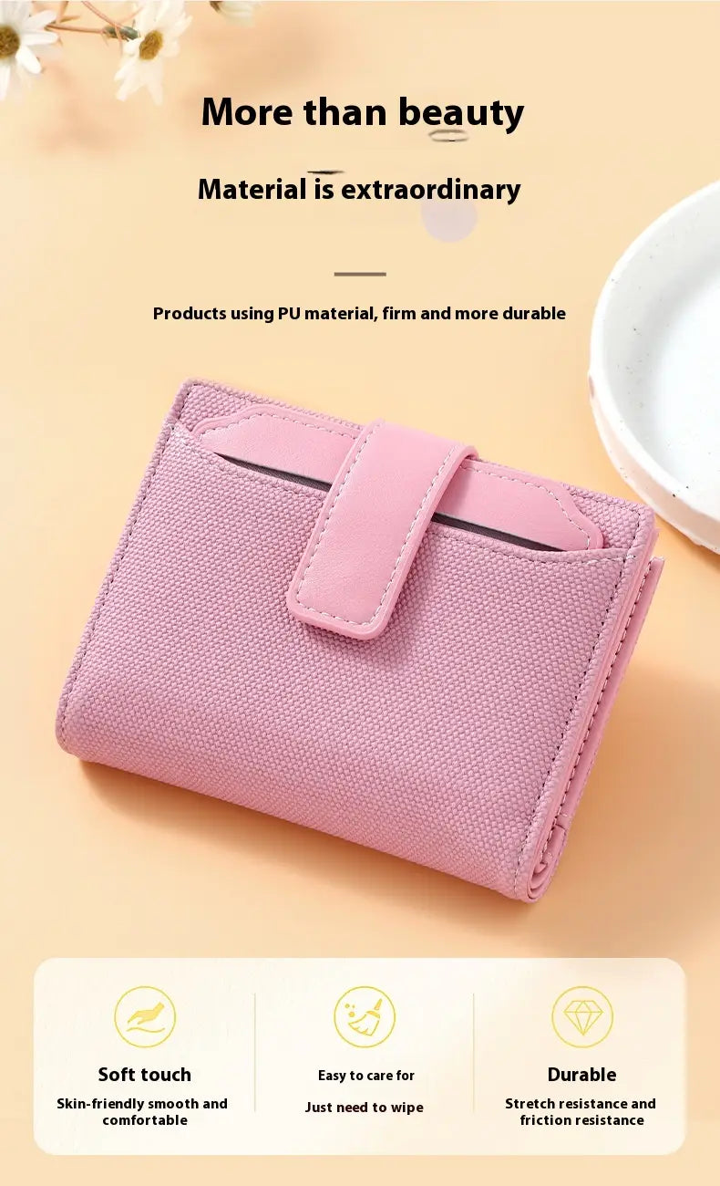 Pink pu leather womens short wallet with woven textured surface and matching flap closure.