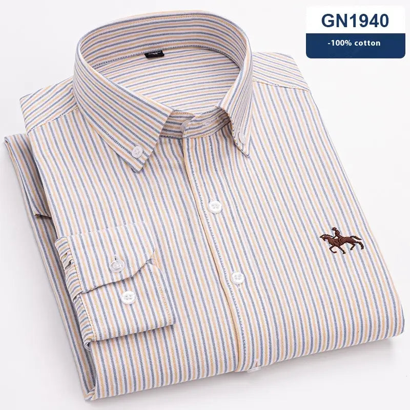 A neatly folded men’s striped cotton embroidered button down shirt in beige and blue with a long-sleeved classic design and an embroidered horse logo on the left chest.