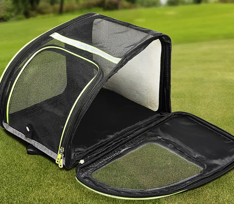 Breathable mesh pet carrier backpack in black with neon green trim and zipper details featuring a soft white interior lining.