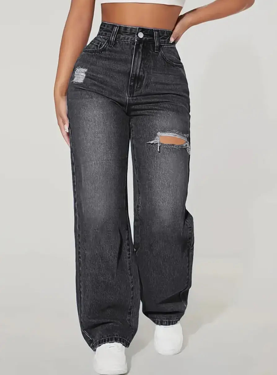 Dark gray distressed high rise wide leg denim jeans made of denim with intentional rips at the knees and a faded wash.