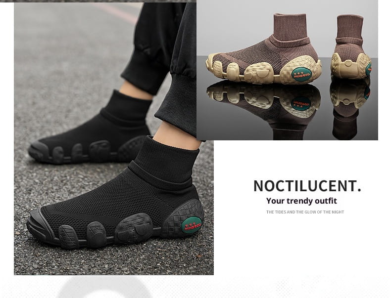 Schwarze Strick-Mesh-Sneaker im mittelhohen Stil für den Alltag und Sport, mit strukturierten segmentierten Sohlen und grünen Logo-Akzenten.