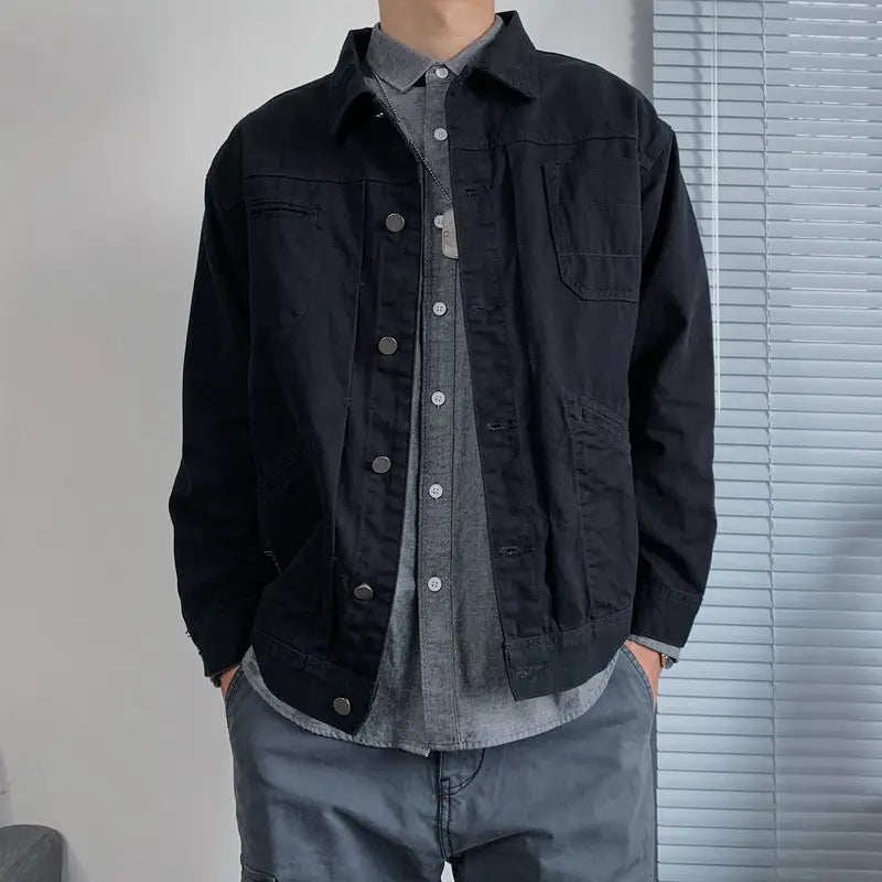 Mens black denim jacket casual retro utility outerwear featuring silver buttons and multiple pockets.
