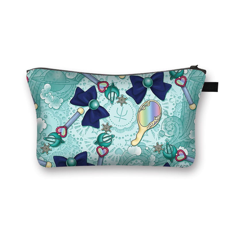 A teal-patterned cosmetic bag featuring whimsical sailor moon-themed bows, wand-like illustrations, and a rainbow mirror design for travel use.