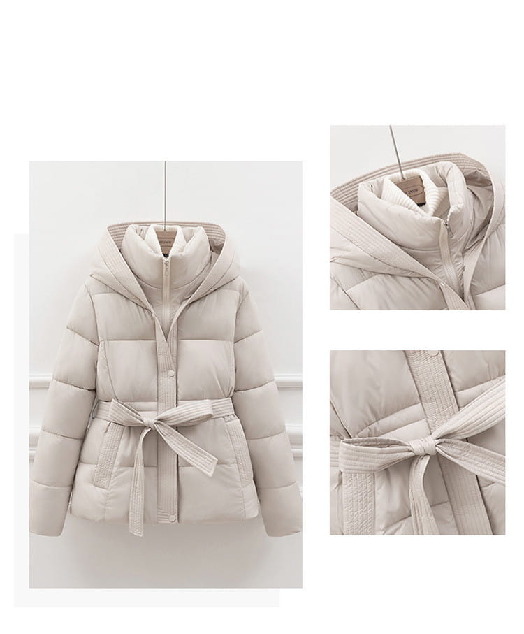 Beige quilted hooded winter puffer coat for women with a matching belt tied at the waist.