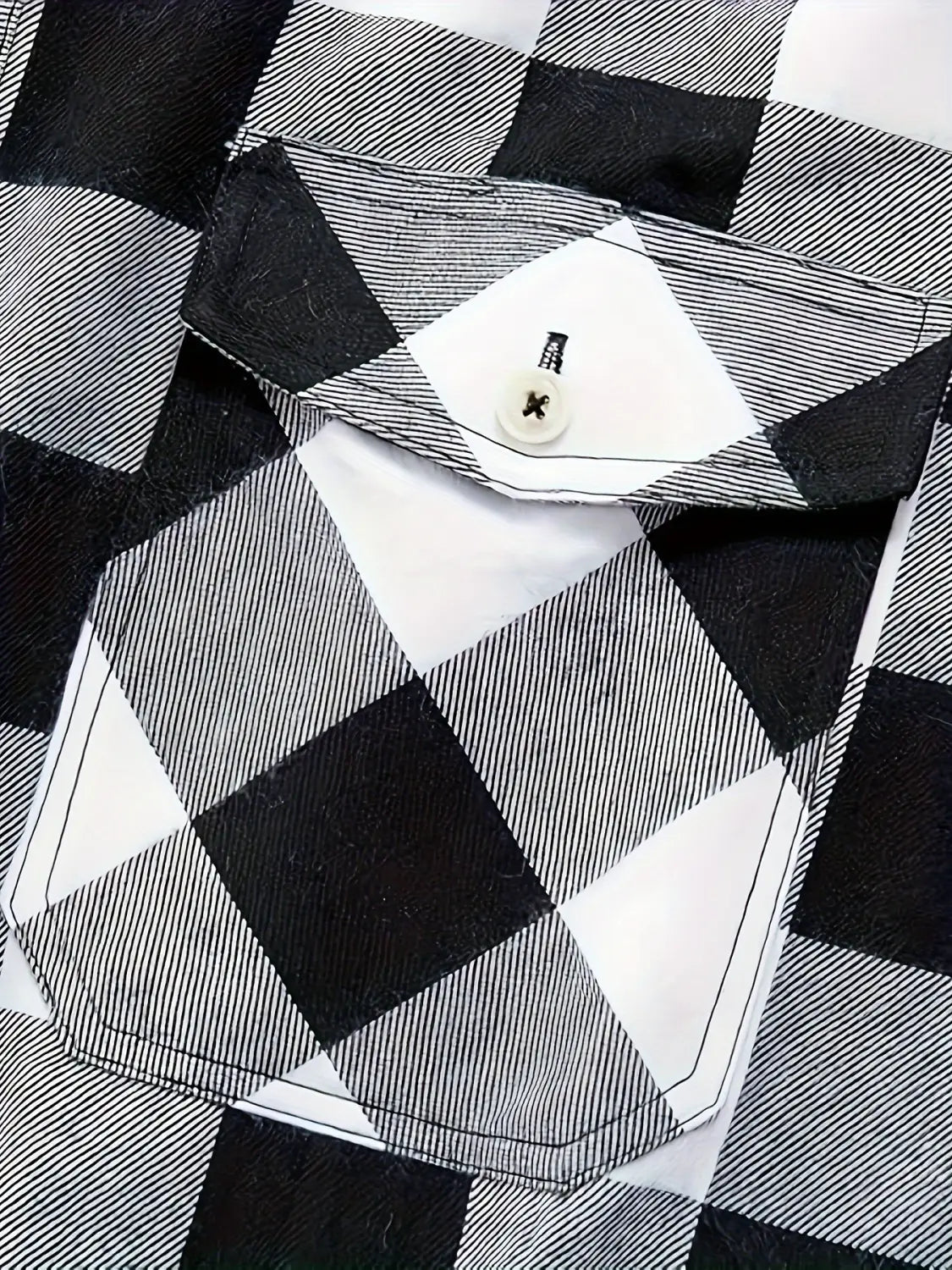 Men’s slim fit black and white checkered flannel button up shirt with a buttoned pocket made from soft plaid fabric.
